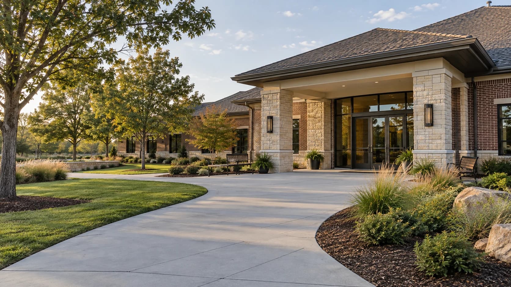 AI-rendered brick and stone medical office with a broad level entrance, low planting and neatly maintained landscape edges